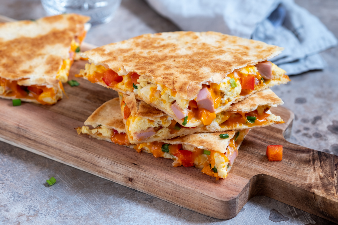 Savory breakfast quesadilla filled with scrambled eggs and melted cheese